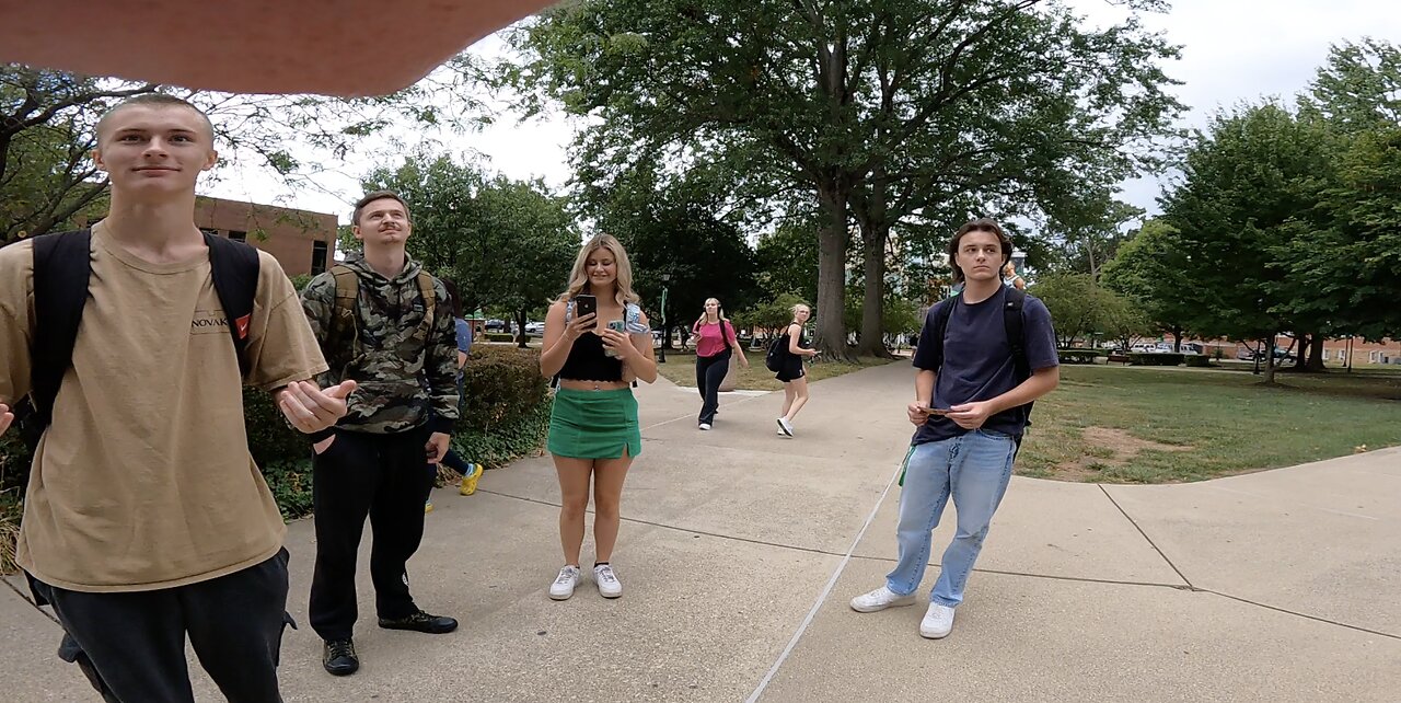 Marshall Univ (West Virginia): Security Cop Tries To Tell Me To Move, I Refuse, Eventually Police Say I Can Stand On a Grassy Knoll Very Close to Plaza So I Comply, have about 10-15 interactions with both sincere Christians and Curious Atheists/Agnostics