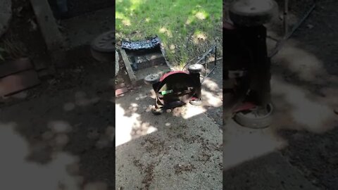 Installation of a new lawnmower blade.