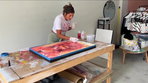 Sarasota artist creates a portrait of Olivia Newton-John using only lipstick