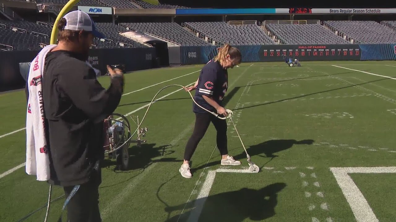 Brónagh Tumulty helps grounds crew paint Solider Field before Bears home opener