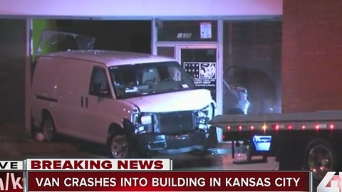 Van crashes into two downtown businesses, driver injured