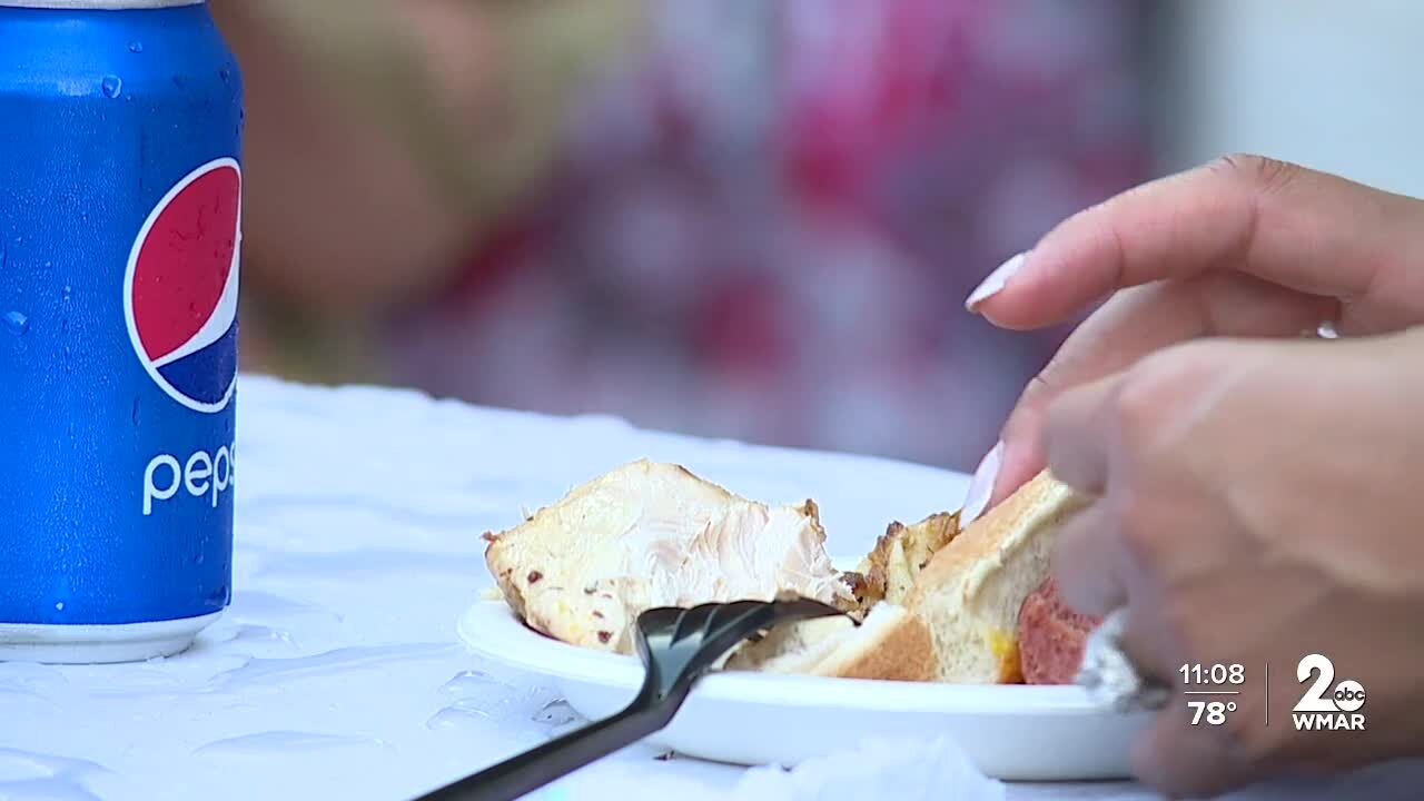 People grabbed a plate to enjoy the local eateries at the Governor's "Buy Local Cookout"