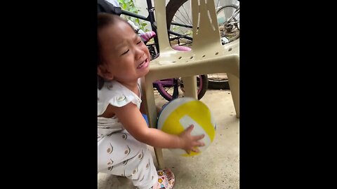 Toddler Struggles to Retrieve Ball
