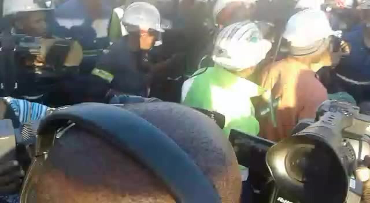 Jubilant workers emerge from underground after ending a nine-day sit-in at Rustenburg mine (8Fu)