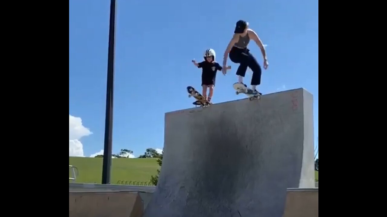 Mother and daughter play skateboards together