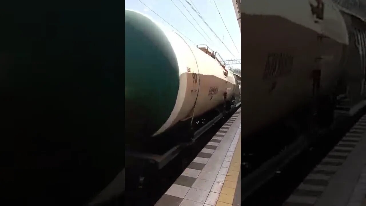 Freight Train Through Passenger Terminal Russia