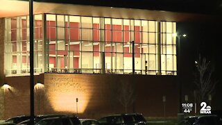 Parent accused of bringing gun on campus speaks out