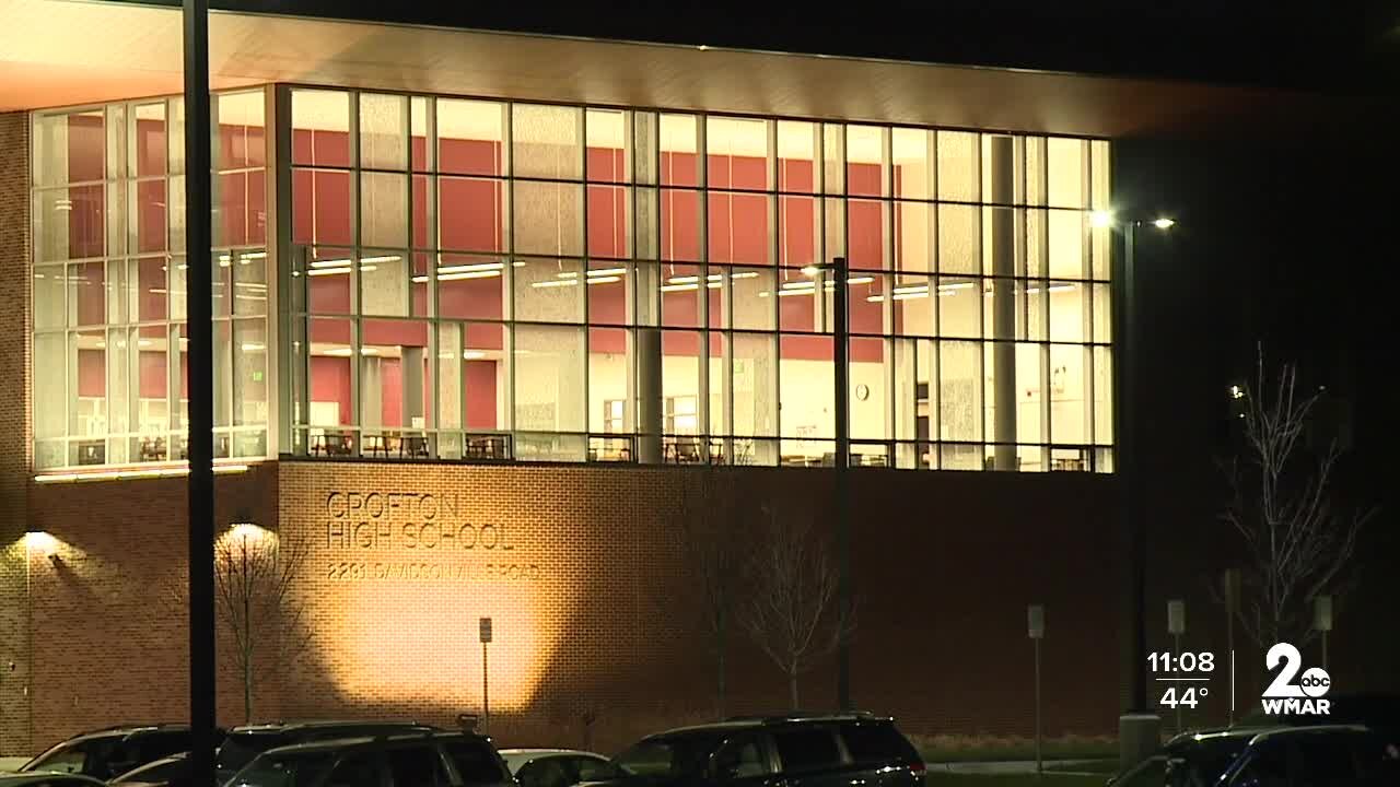 Parent accused of bringing gun on campus speaks out