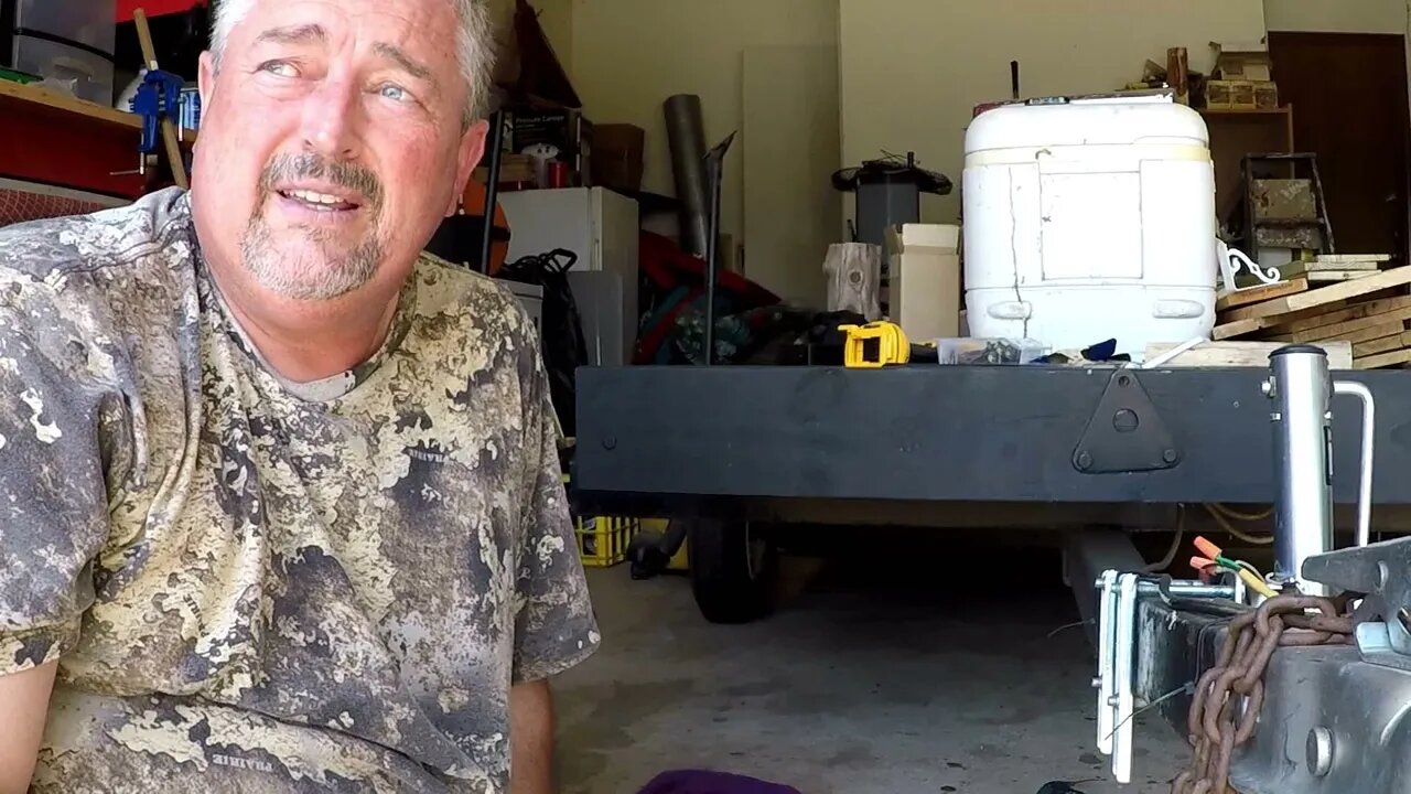 Installing the stabilizer jacks on the portable blind seasoning the smoker