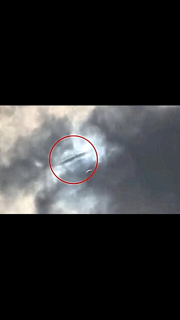 UFO sighted above Arlington, Texas during solar eclipse, it appears to vanish into clouds