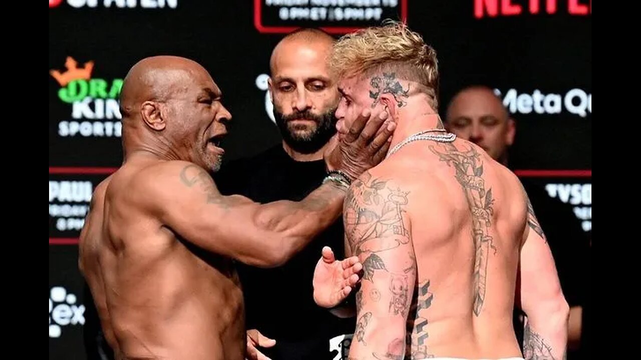 Mike Tyson delivers a slap to Jake Paul.