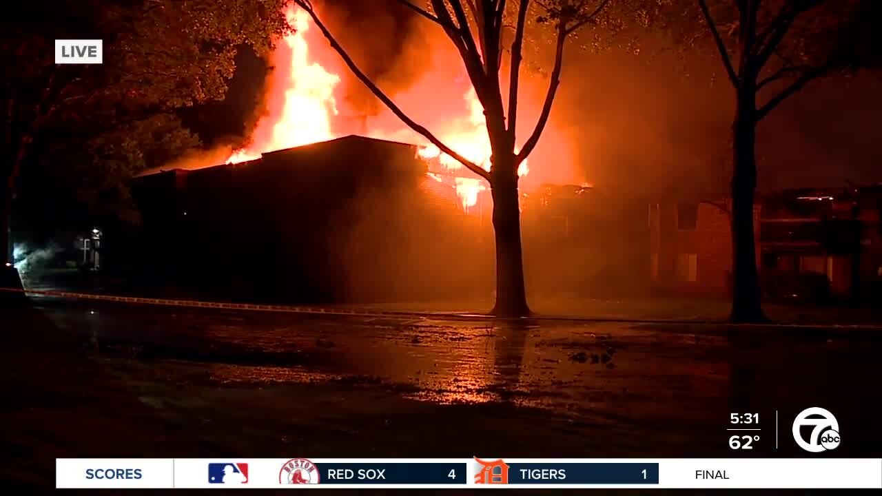 Crews continue to battle massive apartment fire in Westland