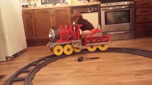 Boy Falls Asleep On Toy Train