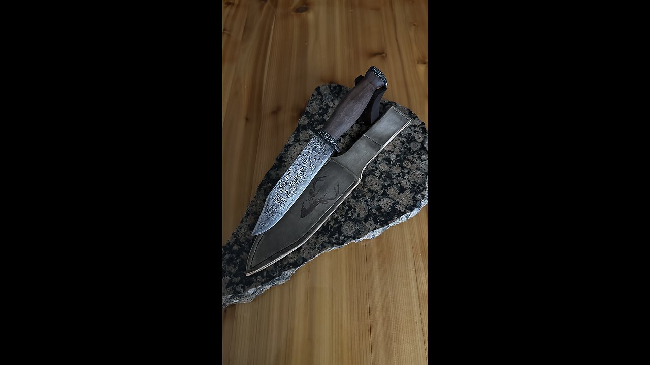 Finishing touches on a raindrop damascus hunting knife