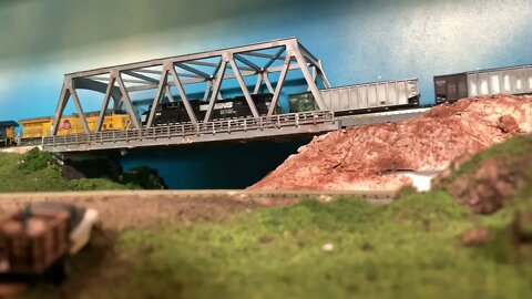N Scale foreign power CSX train crossing the old bridge.