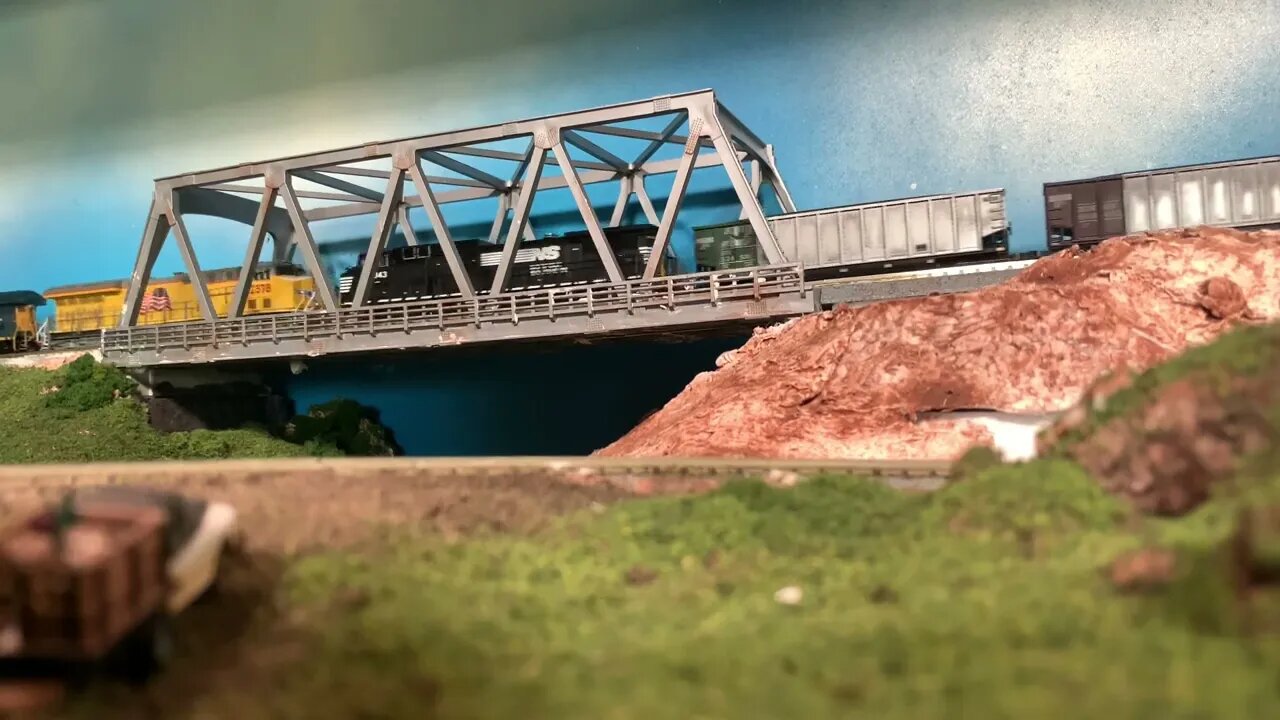 N Scale foreign power CSX train crossing the old bridge.