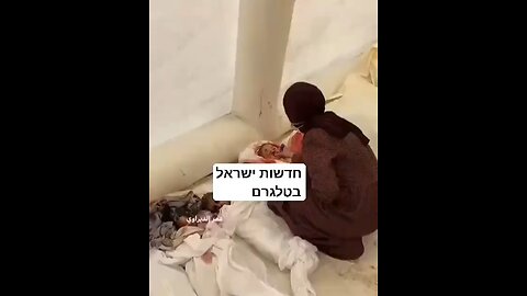 Pallywood Make Up Artist touching up fake dead plastic babies for the media