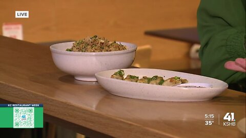 Caitlin Knute taste some food at Strang Hall