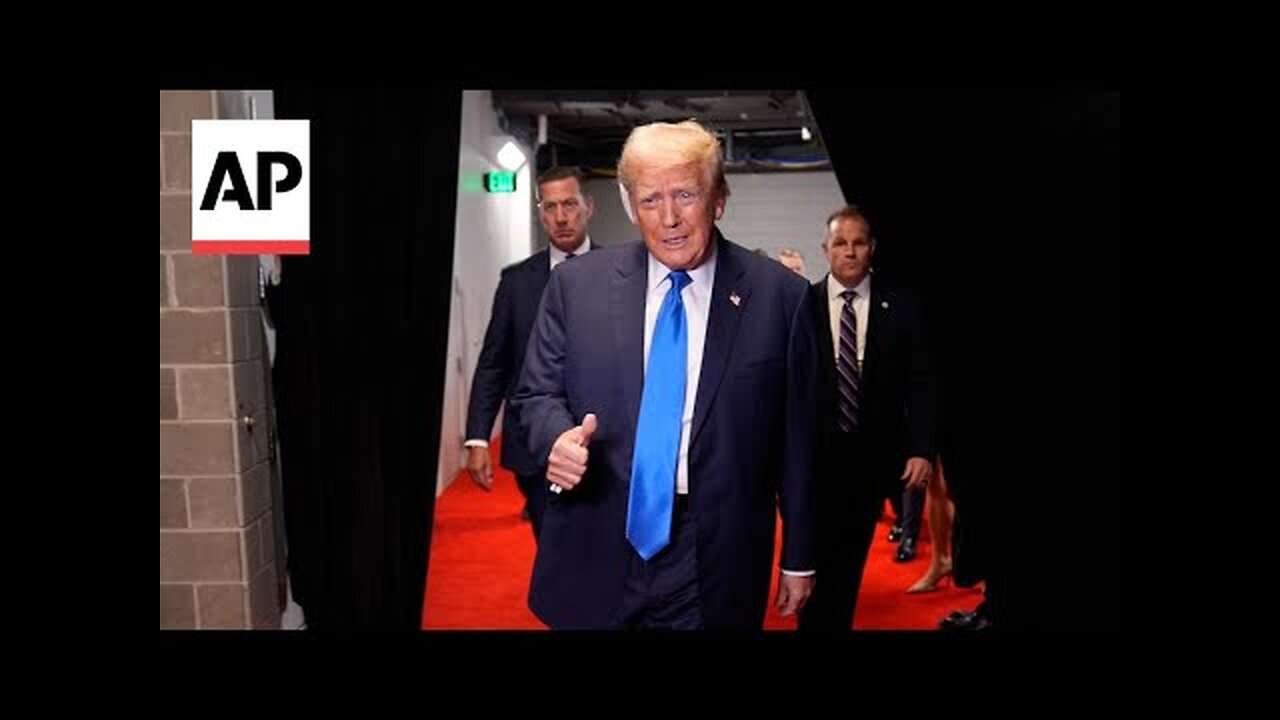 Donald Trump enters the arena on day two of the RNC