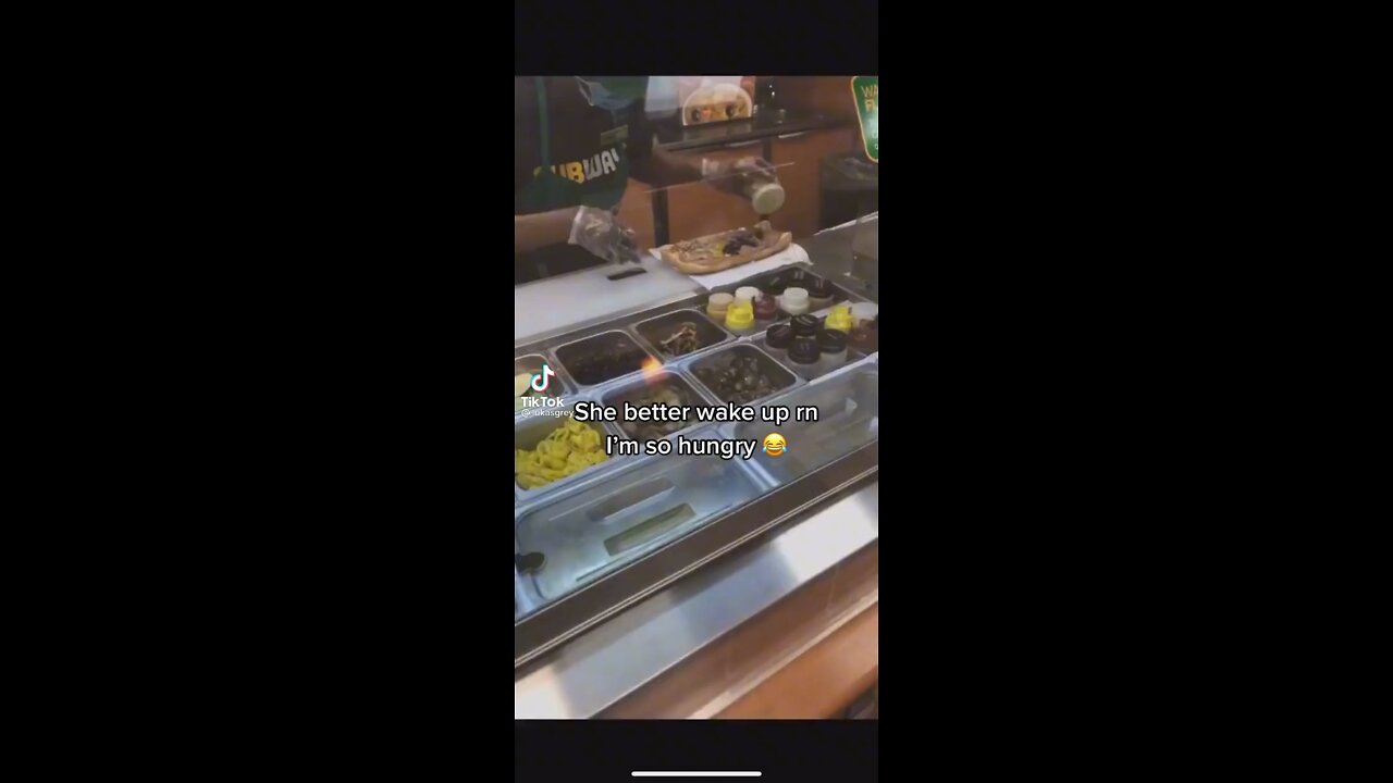 A Subway worker falls asleep while making a sandwich 😂
