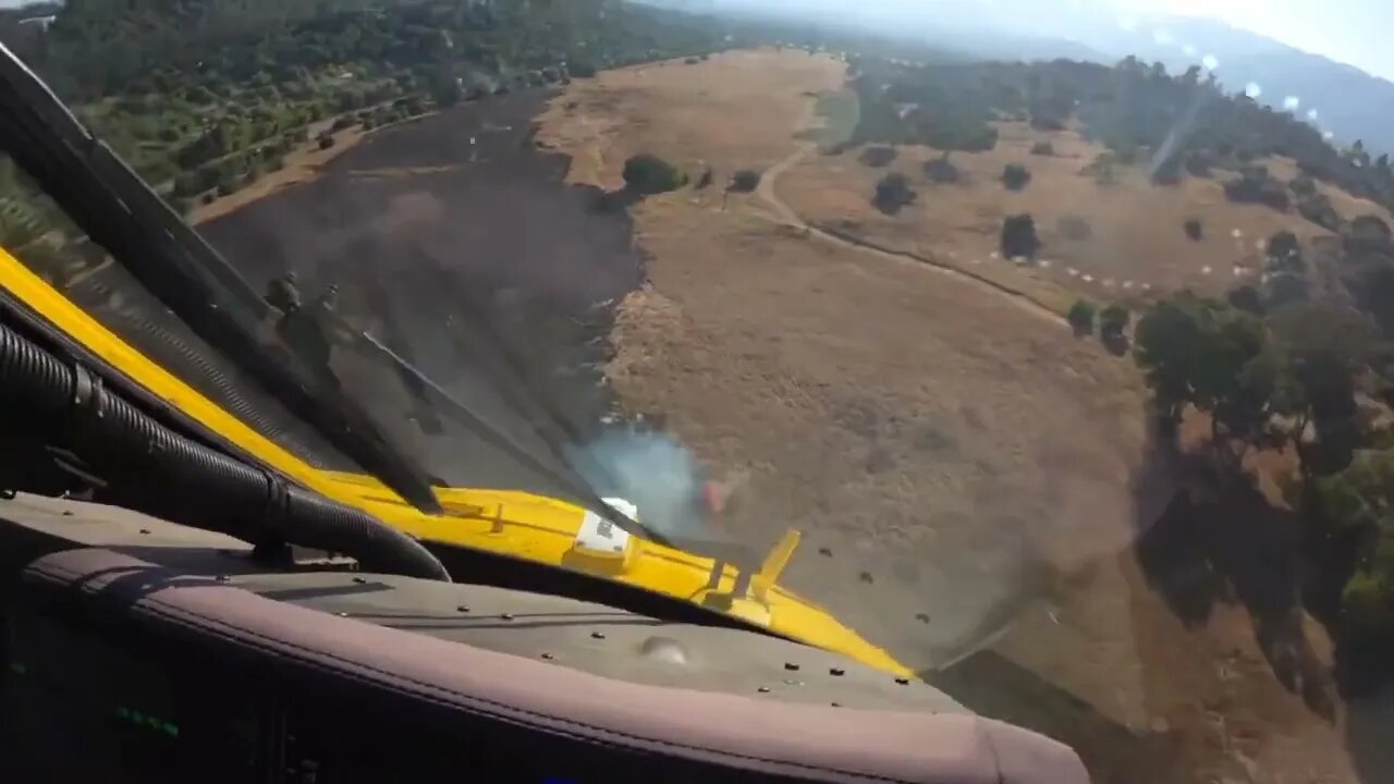 Ever wonder what it looks like from the pilot’s perspective dropping water on a brush fire?