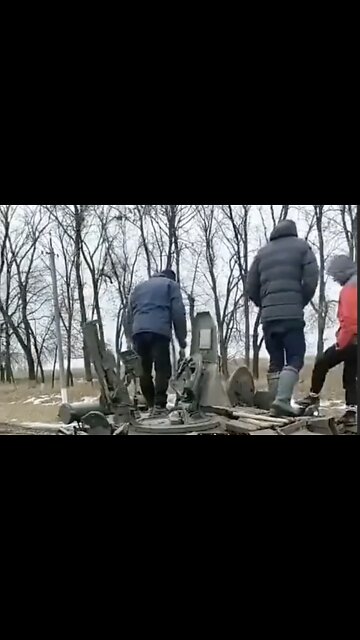 Ukrainian Civilians Inspect Abandoned Russian Tank