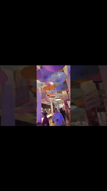 UMBRELLA HANGING UPSIDE DOWN. ASIAN FESTIVAL