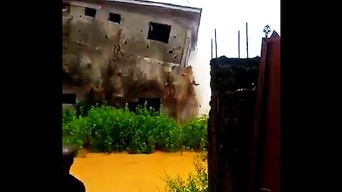 Video captures the incredible moment house collapses in deadly flood