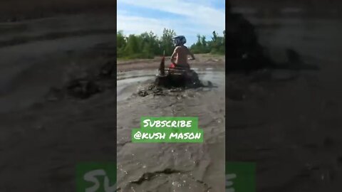 Power wheels jeep pulled through the mud
