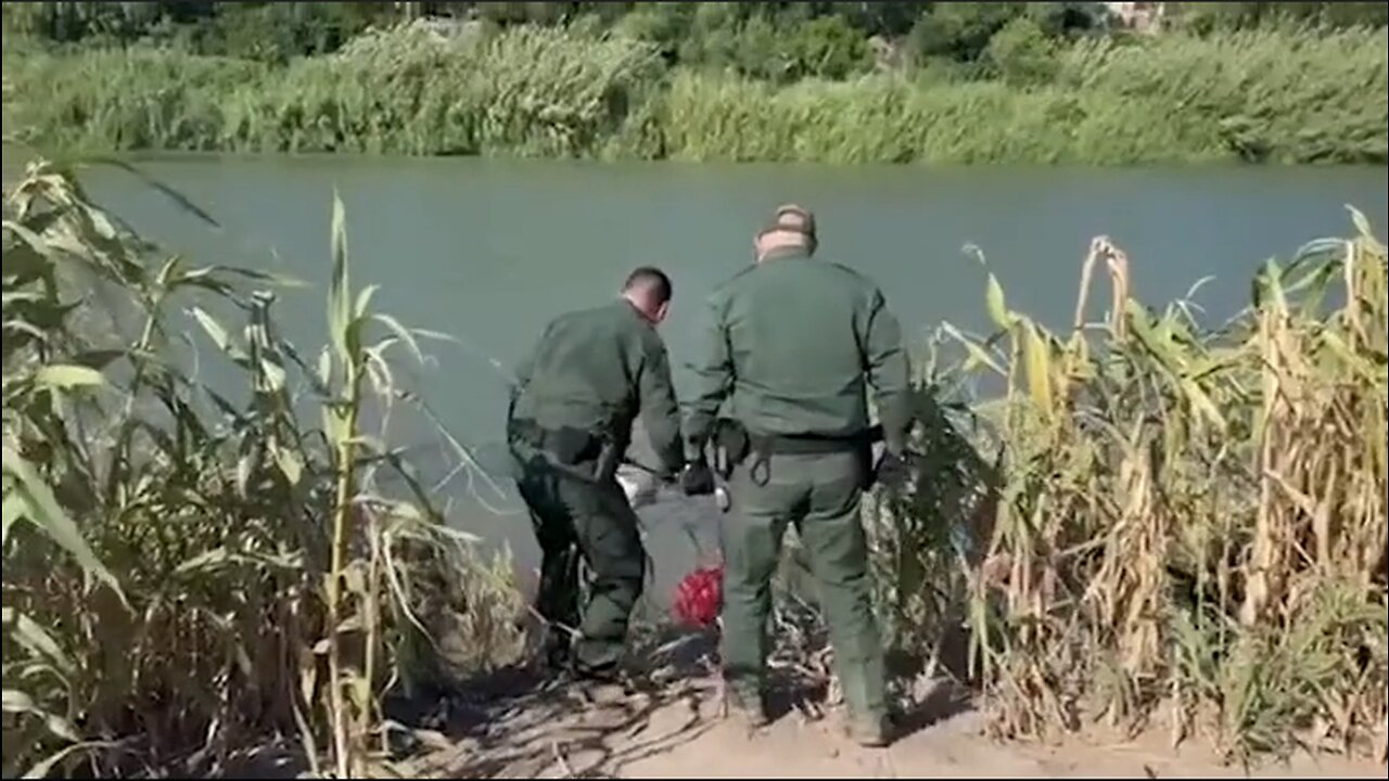 U.S. Border Patrol Agents tear open a wire fence in Texas to allow invaders through