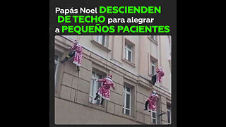 Escuadrón de Papás Noel desciende del techo de un hospital para felicitar a pequeños pacientes