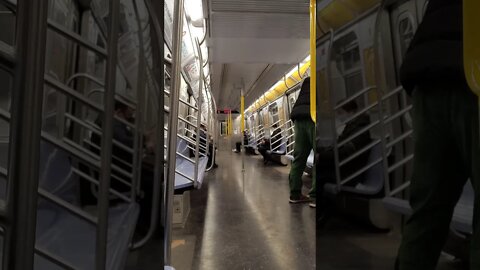 R train uptown in New York City 2021.