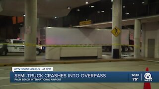 Semi smashes into elevated crosswalk at PBIA