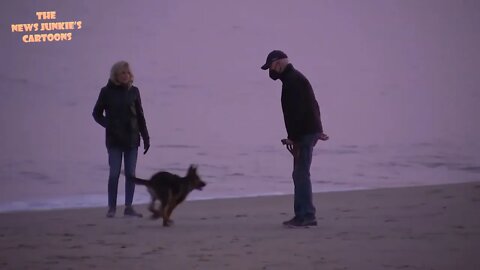 Biden is wearing a mask while outdoors, on an empty beach, surrounded by nobody.