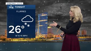 Snow showers continue tonight, then temperatures drop