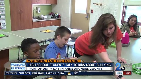 High school students talk to Elementary students about bullying for 'Unity Day'