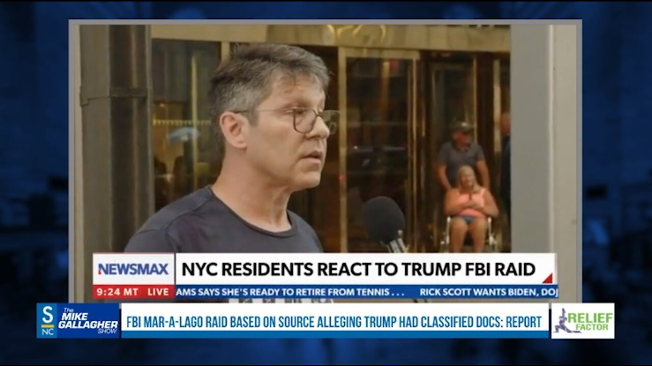 A man is standing in front of Trump Tower with an "Arrest Trump" sign. When asked what Trump should be charged with, he is at a loss for words.