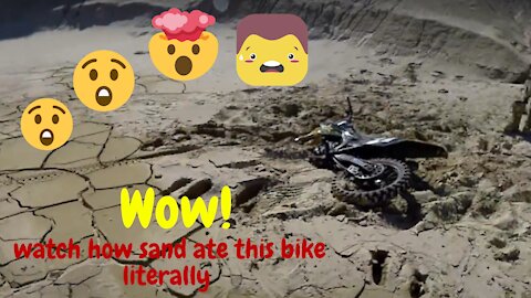 Wow! Watch the dirt bike eaten by sand....literally....