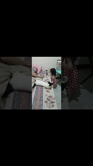 Baby cutie girl plays with her grandfather and talks with the cat