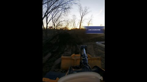 John Deere 524L moving Top Soil