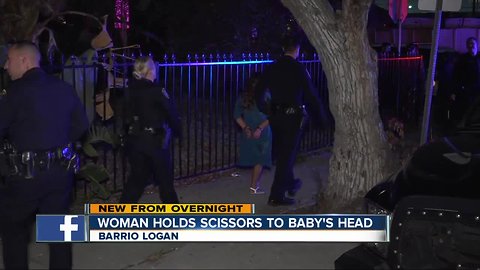 Police arrest woman who held scissors to baby's head