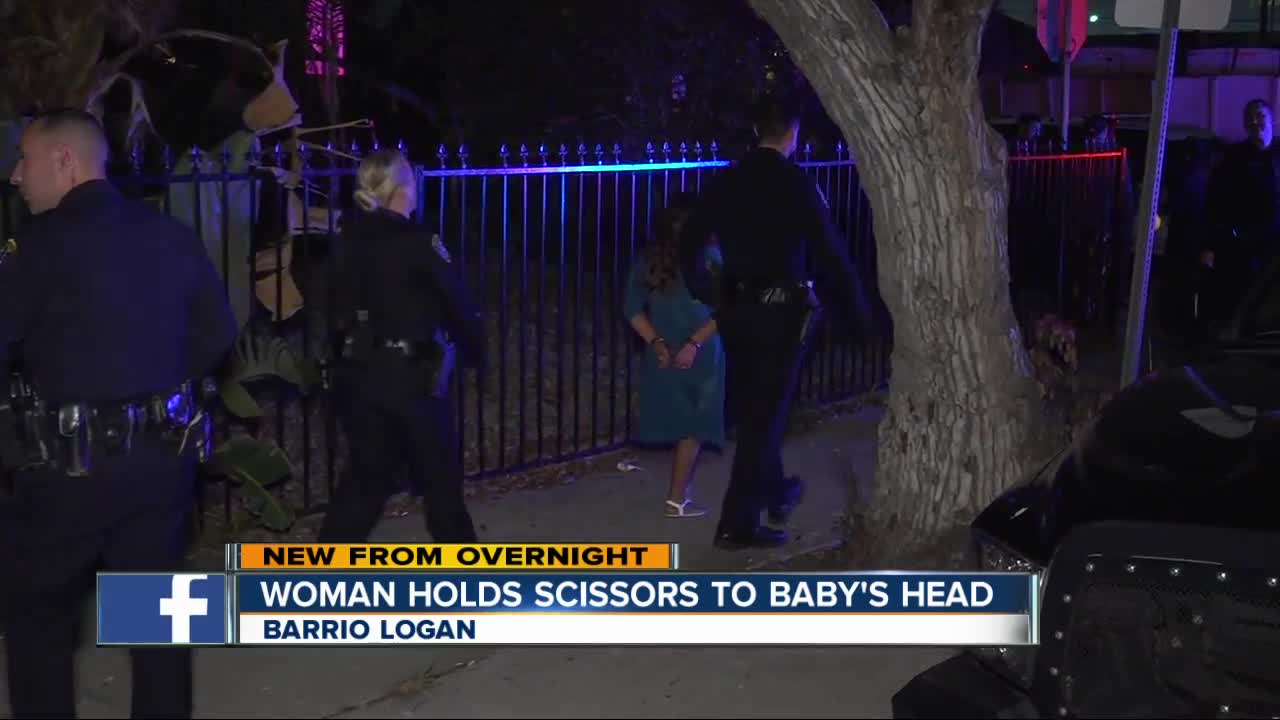 Police arrest woman who held scissors to baby's head