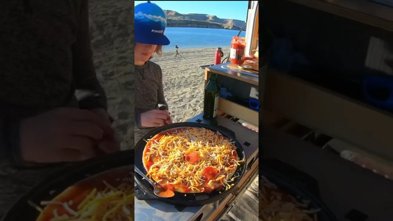 Cooking a pizza over a fire in the Wyoming wilderness. Flaming Gorge in the Tundra TRP Pro