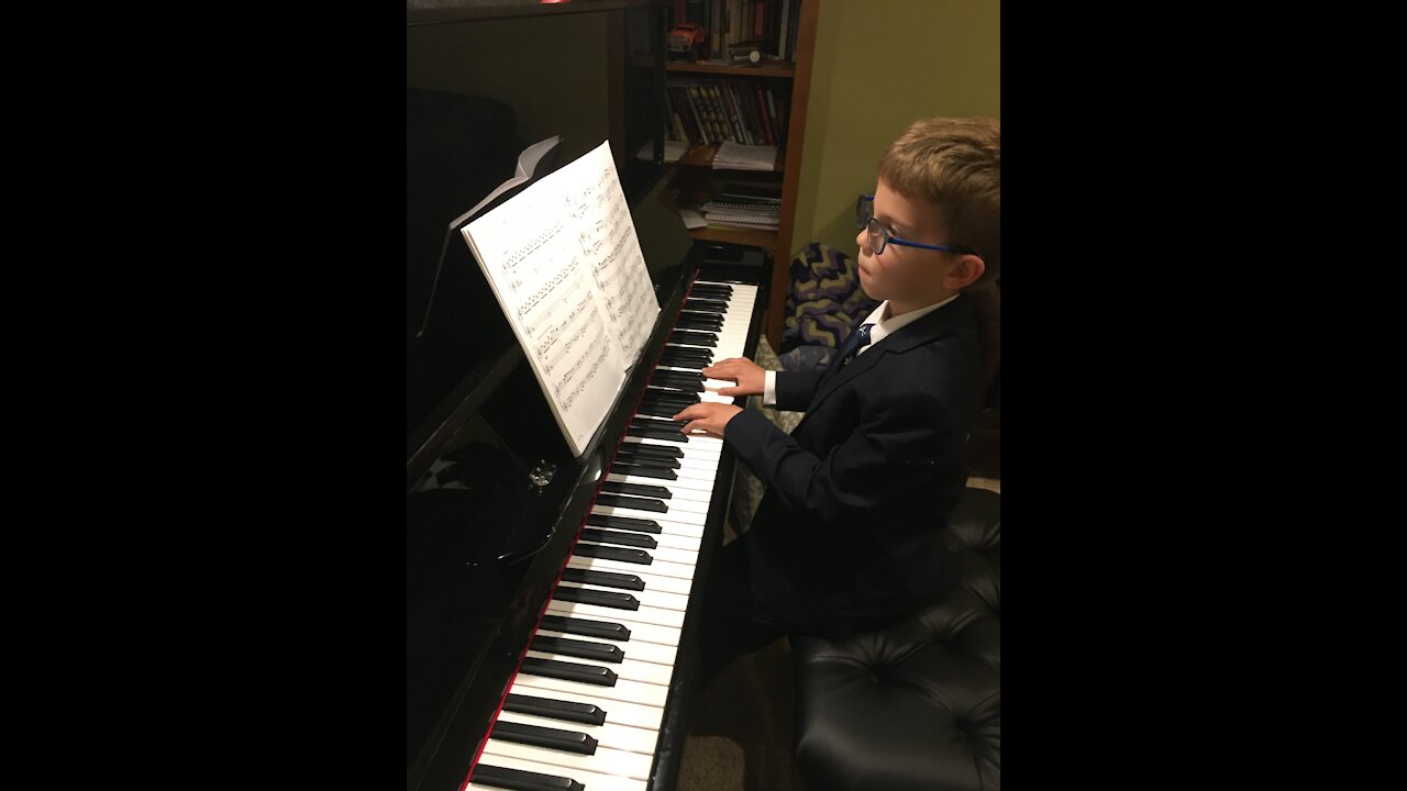 Gifted child plays O Holy Night