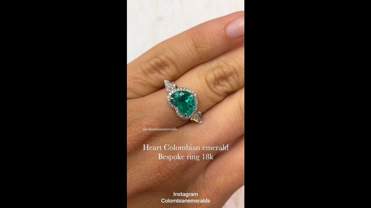 Bespoke AAA heart Cut Colombian emerald and kite shaped three stone halo ring 18K