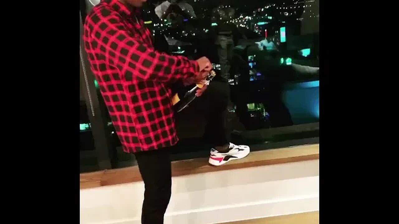 Israel Adesanya popping champagne goes wrong