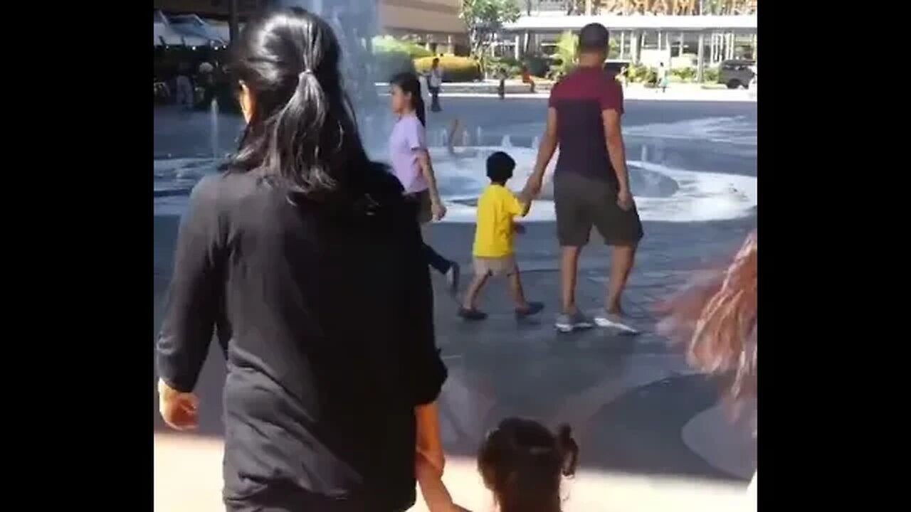 Curly baby girl go at SM in the Philippines with her grandmother and her mommy