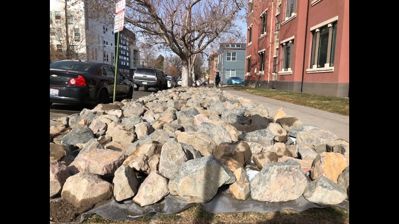 Neighbors, homeless question jagged rock placement on right-of-way near Five Points condo