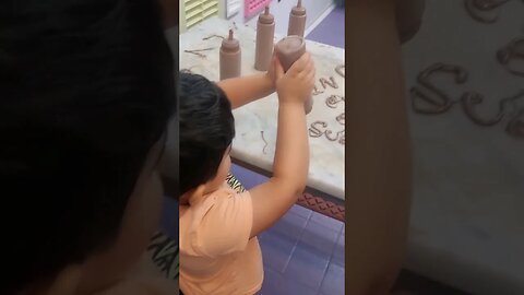 Cute baby 👶💗 having fun with chocolate sauce. #viral #shorts #trending #cute #chocolate