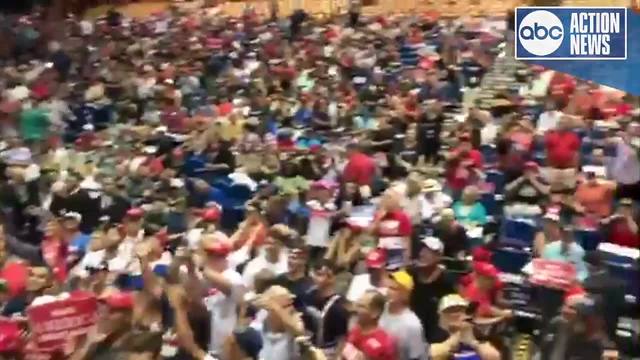 Angry crowd gather yells "CNN sucks!" during Jim Acosta's live shot at Trump rally